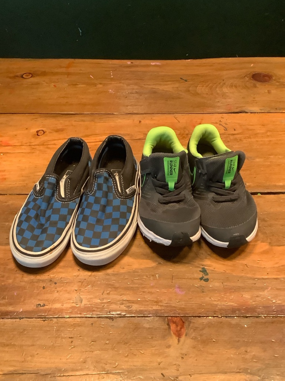 Vans Kids Blue and Black Checkerboard and green and gray running shoes.